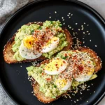 Grated Egg Avocado Toast – The Best 2025 Breakfast Trend You’ll Love 6 Grated egg avocado toast on sourdough with hot honey