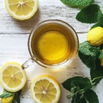 How to Take Lemon Balm for Weight Loss (Best Ways + Tea Recipe) 4 cup of lemon balm tea for weight loss with fresh leaves