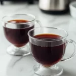 Prune juice and butter for constipation remedy in a warm glass