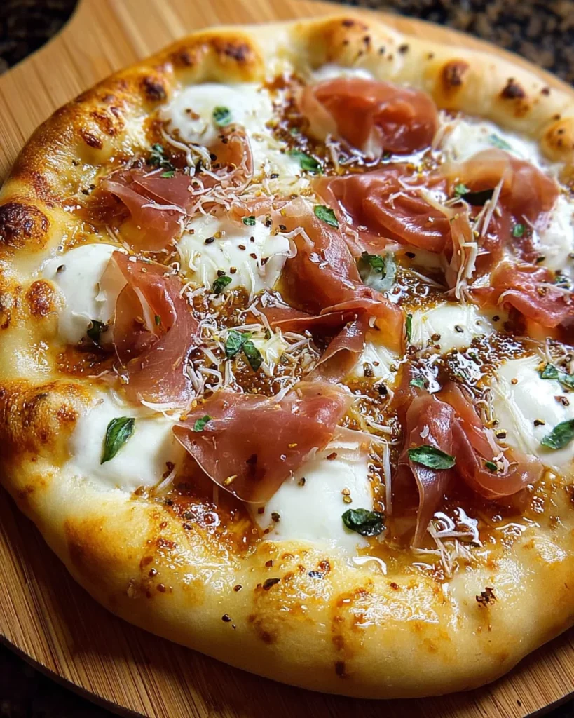 White Pizza with Prosciutto & Hot Honey 4 codinofouad httpss.mj .runmMFmjDzHzx8 realistic Close up amate fadb4b46 915f 4a87 843d ee25f52744f8 2
